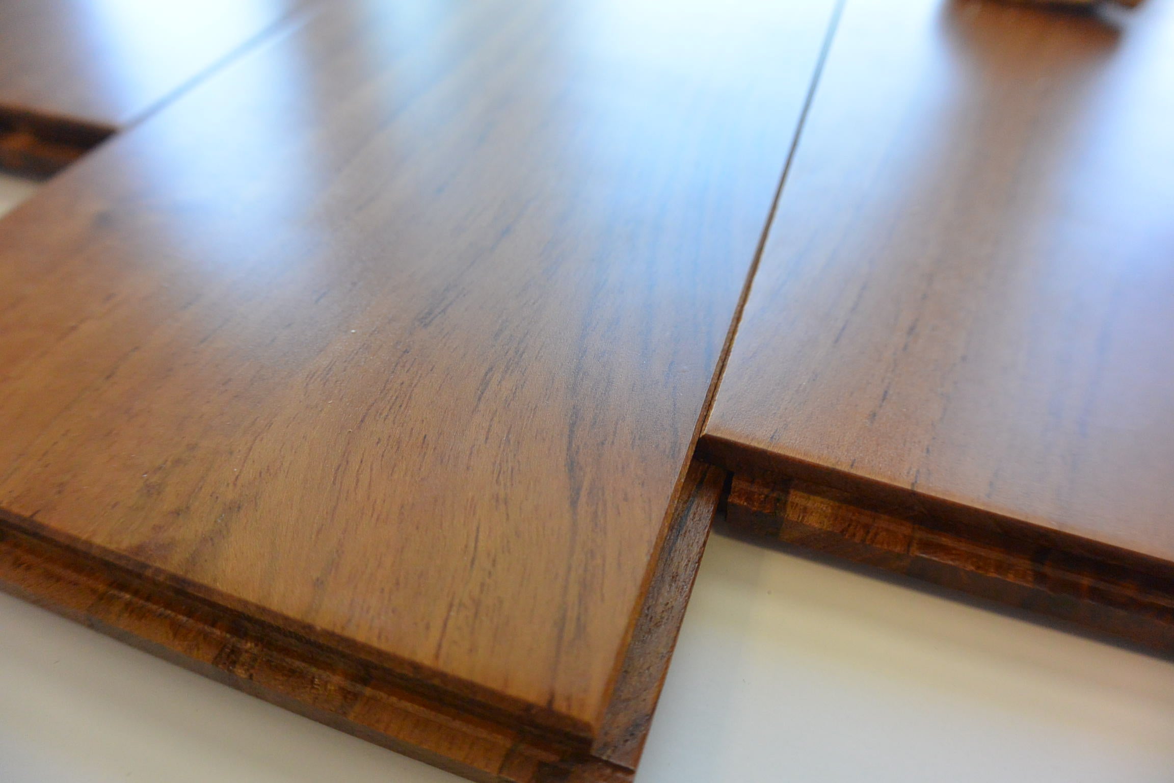 Listone prefinito massiccio in TEAK ASIA di primissima scelta finitura semilucida ECO microbisellato 10x95x600/900 incollato - Eternal Parquet